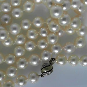 Pearls Estate Pendant 
14 Karat Yellow Pearls Pendant 
 Chain Style: No Chain 
98 Center Pearls 8.00ct Shape: Round With 3 Round Diamonds