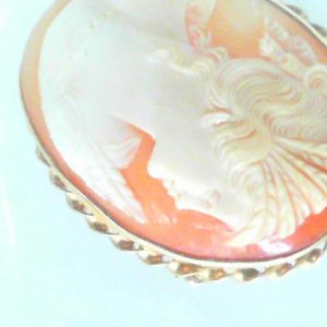 10 Karat Yellow 
Gram Weight 11 Chain Style: No Chain
Cameo hand carved