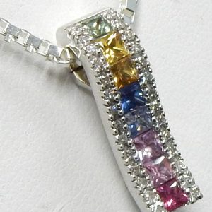 Sapphires Estate Pendant 
14 Karat White Sapphires Pendant 
Gram Weight 3.3 Chain Style: No Chain 
8 Center Sapphires Shape: Princess 1.20ct.tw. With 28 Round Diamonds 0.10 ctw