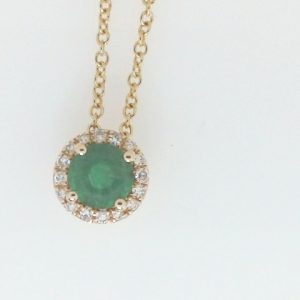 Emerald Estate Pendant 
14 Karat Yellow Green Emerald Pendant 
Gram Weight 2.22 Chain Style: Cable Link 14 Karat Yellow Length: 18in 
1 Center Emerald 0.45ct Shape: Round; Colour: Green With 16 Single Cut Diamonds 16.00 ctw