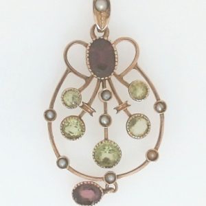 Amethysts Estate Pendant 
9 Karat Yellow Amethysts Pendant 
Gram Weight 2.38 9 Karat 
2 Center Amethysts Shape: Oval With 5 Round Peridot and 8 Round Pearls