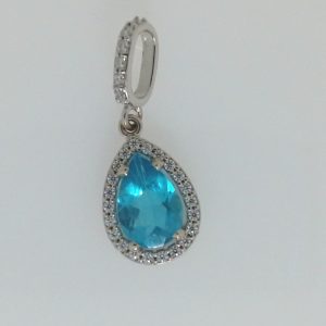 Topaz Estate Pendant 
14 Karat White Blue Topaz Pendant 
 Chain Style: No Chain 14 Karat 
1 Center Topaz 0.279ct Shape: Baguette; Colour: Blue With 25 Round Diamonds 1.39 ctw