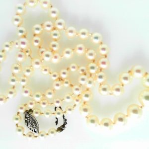 Pearls Estate Pendant 
10 Karat White Cream Pearls Pendant 
 Chain Style: Bead 10 Karat White Length: 20in 
83 Center Pearls Shape: Round; Colour: Cream