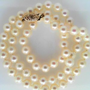 Pearls Estate Pendant  Akoya 
14 Karat Yellow White Pearls Pendant 
 Chain Style: Bead 14 Karat Yellow Length: 18in 
64 Center Pearls Shape: Round; Clarity: OK; Colour: White