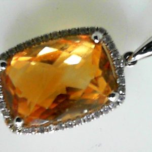 Citrine Estate Pendant 
14 Karat White Orangy Yellow Citrine Pendant 
Gram Weight 3.1 Chain Style: No Chain 14 Karat White 
1 Center Citrine 6.23ct Shape: Retangular Cushion; Colour: Orangy Yellow With 40 Round Diamonds 0.25 ctw