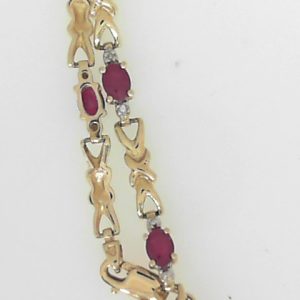 Estate Bracelet With Rubies 
14 Karat Yellow Rubies Bracelet Length: 7in 
Gram Weight 5.87 
9 Center Rubies Shape: Oval With 18 Round Diamonds