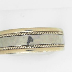 Yellow/White 14 Karat Hammered Band Estate Ring Width 7.5 mm 
Size: 11 
Gram Weight 9.96 gr