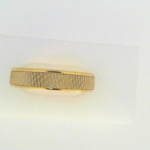 Yellow 18 Karat Engraved Band Ring 
Size: 10 
Gram Weight 7.04 gr