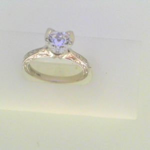 White 14 Karat Engraved Antique Remount 
Size: 6.5
Price excluding center diamond, diamonds available in store to choose from.