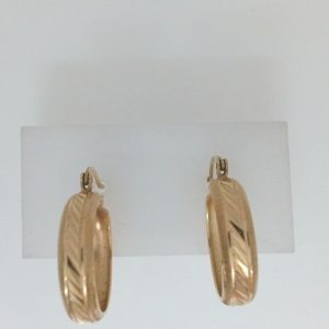 Yellow 10 Karat Engraved Medium Hoop Estate Earring 
Gram Weight 3.93 gr 
Length 20 mm