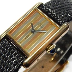 Ladies Estate Watch Cartier Dress 1982
Vendor Style #: 001-42713-001 must de Cartier 3 197877
20.6mm x 27.9mm Gold Plated Strap 
Dial:Tri-colour
Box Not Included/Papers Included
Condition fair
1 Year Warranty