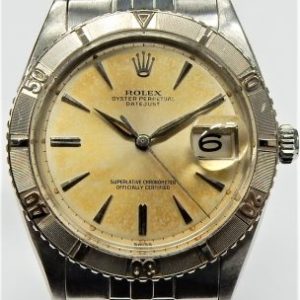 Gents Estate Watch - Rolex Dress 1961
Vendor Style #: Rolex Datejust Turn-O-Graph Jubilee
36 StainlessSteel
Dial:Champagne 
Box Not Included/Papers Not Included
Condition Lovely Patina Orig Brac Date Code 2/61
1 Year Warranty
