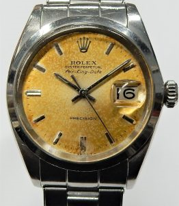 Gents Estate Watch - Rolex Dress 1968
Vendor Style #: Rolex Air-King Date 5700 Oyster
 StainlessSteel
Dial:Champagne Patina
Box Included/Papers Included
Condition Uncommon Model. Commonwealth Only. Orig Bill Eatons $175.00
1 Year Warranty