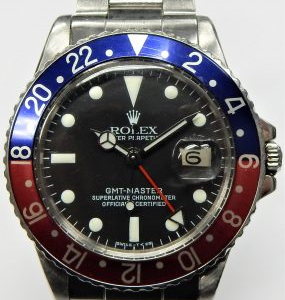 Gents Estate Watch - Rolex Sport 
Vendor Style #: Rolex "Pepsi" GMT-Master 1675 2611798 Oyster
40 StainlessSteel
Dial:Black, replacement
Box Included/Papers Included
Condition Replacement dial and bezel insert. One Owner.
1 Year Warranty