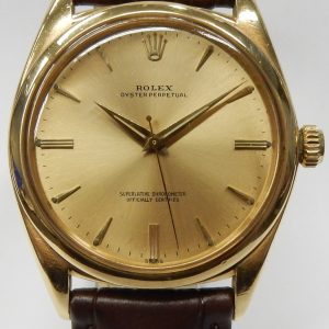 Estate Rolex Dress Year: 1961
Vendor Style #: 1012 Oyster Perpetual smooth bezel SN: 737398 Strap
36mm 18 Karat
Dial: Champagne arrowhead 
Box Not Included/Papers Not Included
Condition Good
1 Year Warranty