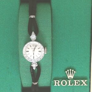 Estate Rolex Dress Year: 1979
Vendor Style #: Hand wind Strap
15mm 14 Karat
Dial: Silver hash 
Box Included/Papers Not Included
Condition Like new
1 Year Warranty