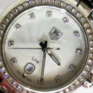 Estate Tag Heuer Dress Year: 2013
Vendor Style #: WAT1414 Link SN: EPS1594 
29mm StainlessSteel
Dial: Silver diamond 
Box Included/Papers Included
Condition Very Good
1 Year Warranty