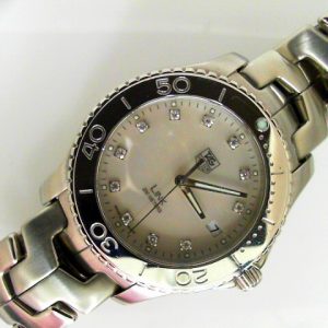 Estate Tag Heuer Divers 
Vendor Style #: WJ1114-0 Link SN: LC3595 
39mmmm StainlessSteel
Dial: White MOP diamond 
Box Not Included/Papers Not Included
Condition Very good
1 Year Warranty