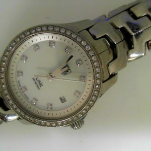 Estate Tag Heuer Dress 
Vendor Style #: WJF1319 Link diamond dial & bezel SN: EER8679 
27mm StainlessSteel
Dial: White MOP diamond 
Box Not Included/Papers Not Included
Condition Good
1 Year Warranty