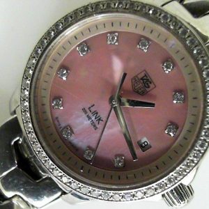 Estate Tag Heuer Dress 
Vendor Style #: WJF131E Link quartz SN: VB0011 
27mm StainlessSteel
Dial: Pink MOP diamond 
Box Not Included/Papers Not Included
Condition Very good
1 Year Warranty