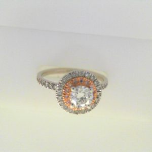 Diamond Engagement Ring 
14 Karat Rose/White Engagement Ring 1twt
Finger Size 6.5 
1 Center Diamond 0.51ct Shape: Round Clarity: SI1 Colour: I With 14 Round Diamonds 0.08 ctw Round Diamond 0.41 ctw 1