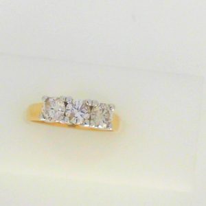 Diamond Engagement Ring 
14 Karat Yellow/White Engagement Ring 1twt
Finger Size 6.5 
3 Center Diamonds Shape: Round Clarity: I1 Colour: J/K 1