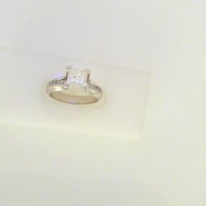 Diamond Engagement Ring 
14 Karat White Engagement Ring 1.15twt
Finger Size 5 Gram Weight 4.6gram weight 
1 Center Diamond 1.00ct Shape: Princess Clarity: VS2 Colour: G With 12 Round Diamonds 0.15 ctw 1.15