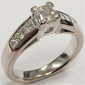 Estate Diamond Engagement Ring 
18 Karat White Estate Engagement Ring 
Finger Size 4 Gram Weight 5.1 
1 Center Canadian Diamond 0.35ct Shape: Princess; Clarity: SI2; Colour: G With 6 Princess Diamonds 0.40 ctw 0.75