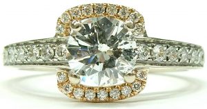 Estate Diamond Engagement Ring 
18 Karat Rose/White Estate Engagement Ring 
 Gram Weight 3.6 
1 Center Diamond 0.73ct Shape: Round; Clarity: I1; Colour: H Round Diamond 0.27 ctw 1