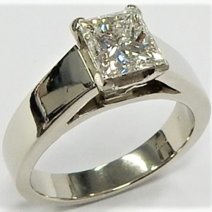 Estate Diamond Engagement Ring 
18 Karat White Estate Engagement Ring 
Finger Size 4.25 Gram Weight 5.9 
1 Center Diamond 1.00ct Shape: Princess; Clarity: SI1; Colour: H; GIA 6227084120 1