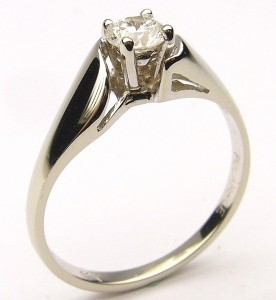 Estate Diamond Engagement Ring 
18 Karat White Estate Engagement Ring Width 1.5mm 
Finger Size 6.5 Gram Weight 2.4 
1 Center Diamond 0.30ct Shape: Round; Clarity: SI2; Colour: H 0.3