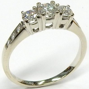 Estate Diamond Engagement Ring 
14 Karat White Estate Engagement Ring 
Finger Size 6.75 Gram Weight 2.7 
1 Center Diamond 0.25ct Shape: Round; Clarity: SI1; Colour: G/H With 2 Round Diamonds 0.16 ctw and 6 Round Diamonds 0.11 ctw 0.52
