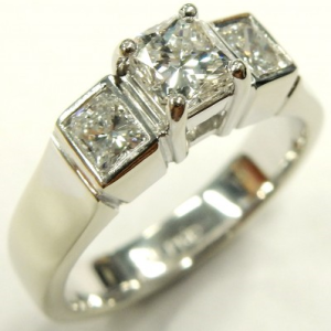 Estate Diamond Engagement Ring 
14 Karat White Estate Engagement Ring 
Finger Size 6 
3 Center Diamonds Shape: Various Shapes; Clarity: VS2; Colour: H 1.23