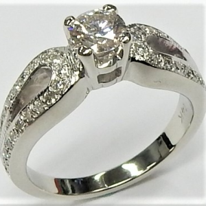 Estate Diamond Engagement Ring 
14 Karat White Estate Engagement Ring Width 2.3mm 
Finger Size 6.5 Gram Weight 5.5 
1 Center Diamond 0.40ct Shape: Round; Clarity: SI2; Colour: I/J With 40 Round Diamonds 0.20 ctw 0.6