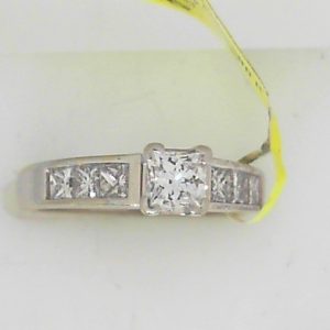 Estate Diamond Engagement Ring 
14 Karat White Estate Engagement Ring 
 Gram Weight 4.2 
1 Center Diamond 0.34ct Shape: Princess; Clarity: I1; Colour: I/J With 6 Princess Diamonds 0.40 ctw 0.74
