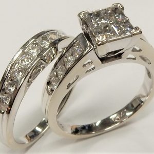 Estate Diamond Engagement Ring 
14 Karat White Estate Engagement Ring 
Finger Size 8 Gram Weight 9.32 
4 Center Diamonds Shape: Princess; Clarity: I1; Colour: I With 18 Round Diamonds 1.28 ctw 1.5