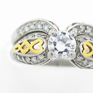 Estate Diamond Engagement Ring 
Platinum Yellow/White Estate Engagement Ring 
Finger Size 6.25 Gram Weight 8.6 
1 Center Diamond 0.39ct Shape: Round; Clarity: SI1; Colour: I With 22 Round Diamonds 0.20 ctw 0.59