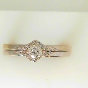 Estate Diamond Engagement Ring 
10 Karat White Estate Engagement Ring 
Finger Size 6.5 Gram Weight 3.3 
1 Center Canadian Diamond 0.16ct Shape: Round; Clarity: SI; Colour: I With 20 Round Diamonds 0.075 ctw 0.235