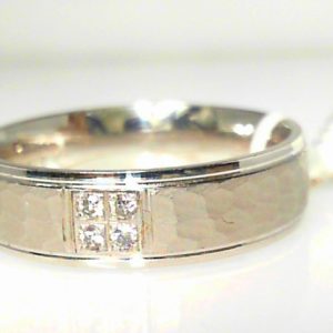 Diamond Ring- Men's 
10 Karat White Men's Diamond Ring 
Finger Size 10 Gram Weight 6.32 
 Center Diamond Shape: Round 0.06