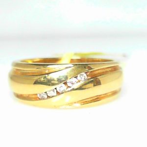 Estate Diamond Ring - Men's 
14 Karat Yellow Estate Diamond Ring 
Finger Size 7.25 Gram Weight 6.3 
5 Center Diamonds Shape: Round 0.07