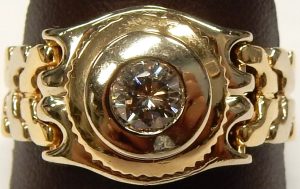 Gent's Yellow/White 14 Karat Contemporary Estate Diamond Ring Size 10 With One 0.50Ct Round O/P I2 Diamond Discount: 30
Gram Weight: 12.6. Tag Heuer Link style two tone flexible shank.
