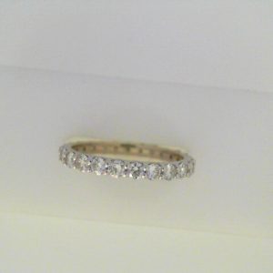 Diamond Wedding/Anniversary Ring 
18 Karat White Wedding/Anniversary Ring 
Finger Size 7.25 
25 Center Diamonds Shape: Round; Clarity: SI2; Colour: H 1.3
