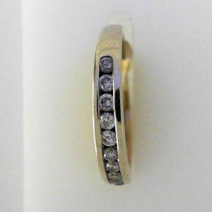 Estate Diamond Anniversary Ring 
14 Karat Yellow Estate Anniversary Ring Width 3.2mm 
Finger Size 5 Gram Weight 2.4 
10 Center Diamonds Shape: Round; Clarity: I1; Colour: H/I 0.2
