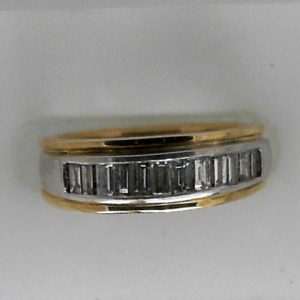 Estate Diamond Anniversary Ring 
14 Karat Yellow/White Estate Anniversary Ring 
Finger Size 4.75 Gram Weight 4.4 
12 Center Diamonds Shape: Baguette; Clarity: VS; Colour: H 0.5