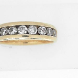 Estate Diamond Anniversary Ring 
14 Karat Yellow Estate Anniversary Ring 
Finger Size 10.75 Gram Weight 5.8 
8 Center Diamonds Shape: Round; Clarity: I2; Colour: K 1