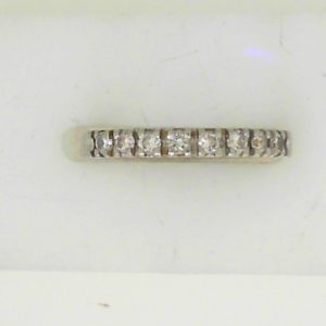 Estate Diamond Anniversary Ring 
14 Karat White Estate Anniversary Ring 
Finger Size 5.5 Gram Weight 2.27 
8 Center Diamonds Shape: Round; Clarity: SI; Colour: H 0.25