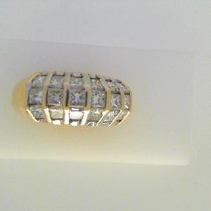 Estate Diamond Dinner Ring - Women's 
14 Karat Yellow Estate Dinner Ring Width 4.9mm 
Finger Size 8.25 Gram Weight 8.1 
18 Center Diamonds Shape: Princess; Clarity: SI1; Colour: I/J 2