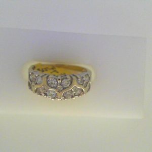 Estate Diamond Dinner Ring - Women's 
14 Karat White Estate Dinner Ring Width 3mm 
Finger Size 4.5 Gram Weight 3.8 
17 Center Diamonds Shape: Round; Clarity: SI1; Colour: J 0.5