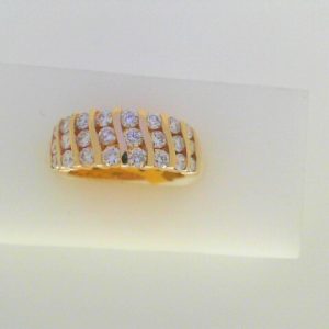 Estate Diamond Dinner Ring - Women's 
14 Karat Yellow Estate Dinner Ring Width 2.7mm 
Finger Size 5.5 Gram Weight 5.4 
24 Center Diamonds Shape: Round 1