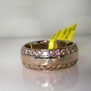 Estate Diamond Dinner Ring - Women's 
14 Karat White Estate Dinner Ring Width 7mm 
Finger Size 6 Gram Weight 7 
24 Center Diamonds Shape: Round; Clarity: VS1; Colour: J 0.5